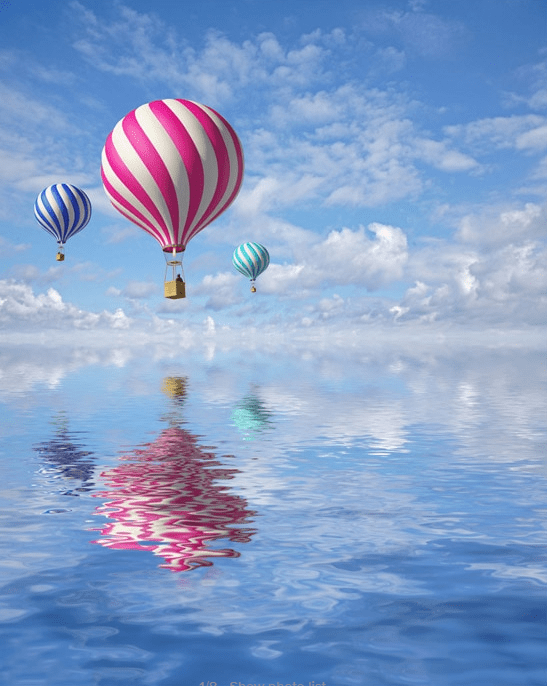 Balloons above ocean painting